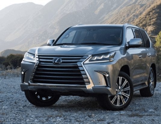 silver Lexus LX 570 SUV mountain terrain