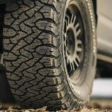 Close-up view of the aggressive tread pattern on a BFGoodrich All-Terrain T/A KO3 radial tire designed for off-road performance.